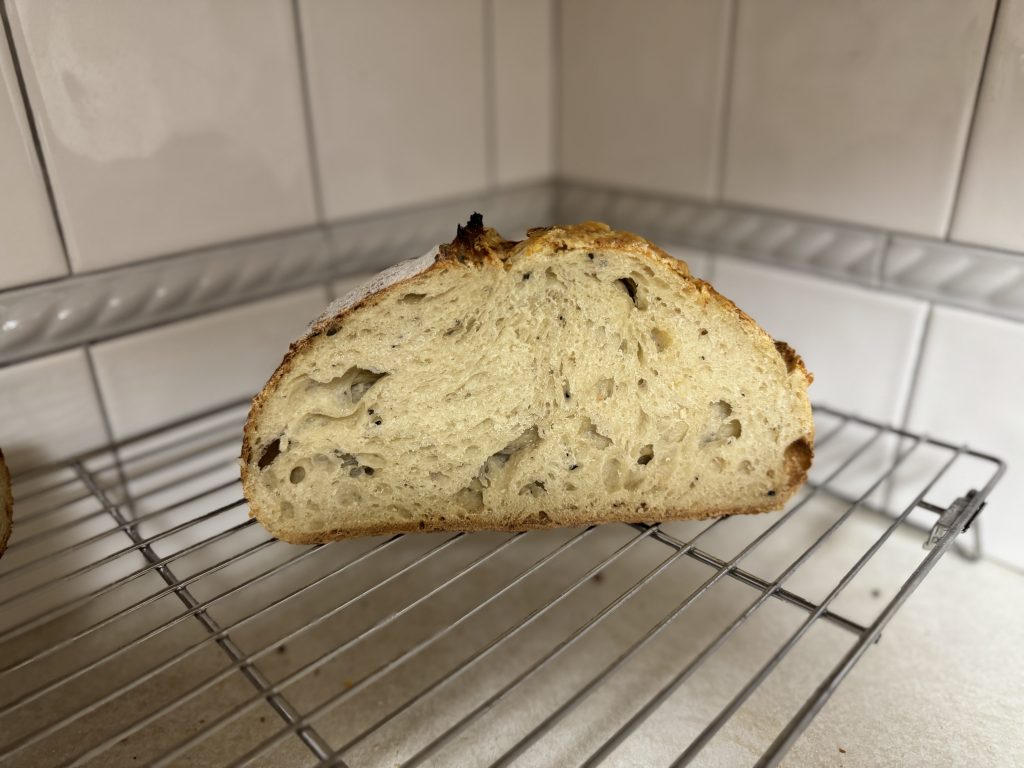 A halved loaf of Everything But the Bagel Sourdough